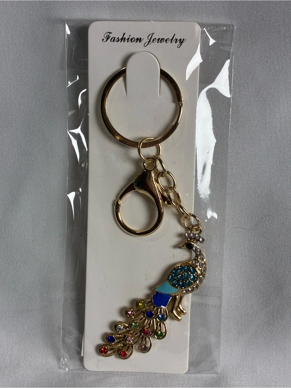 Gold Peacock Key & Card Holder Charm with Blue Enamel and Multicolor Stones